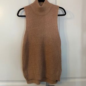 Sleeveless cable knit turtle neck sweater